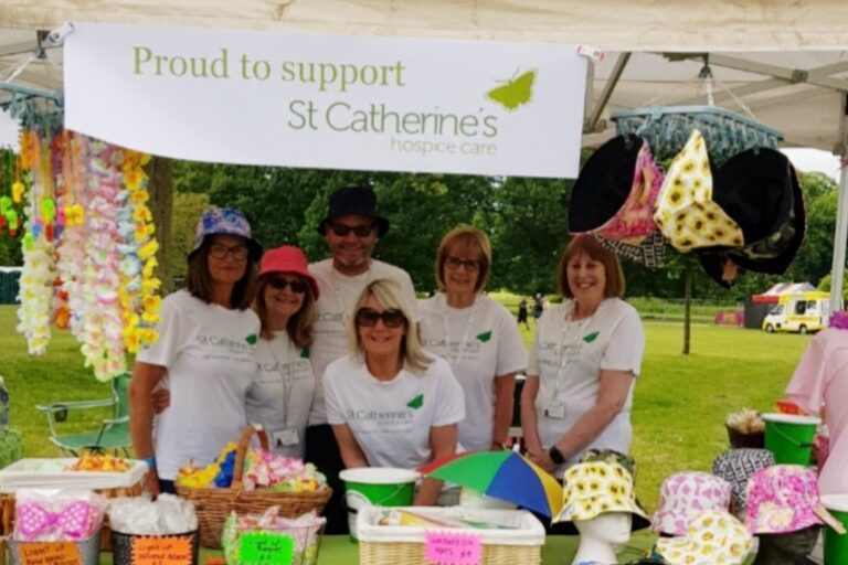 St Catherines Hospice team at their Music in the Park stand in 2023