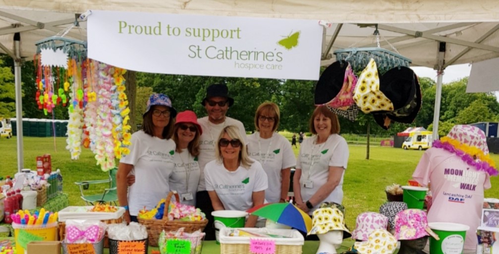 St Catherines Hospice team at their Music in the Park stand in 2023